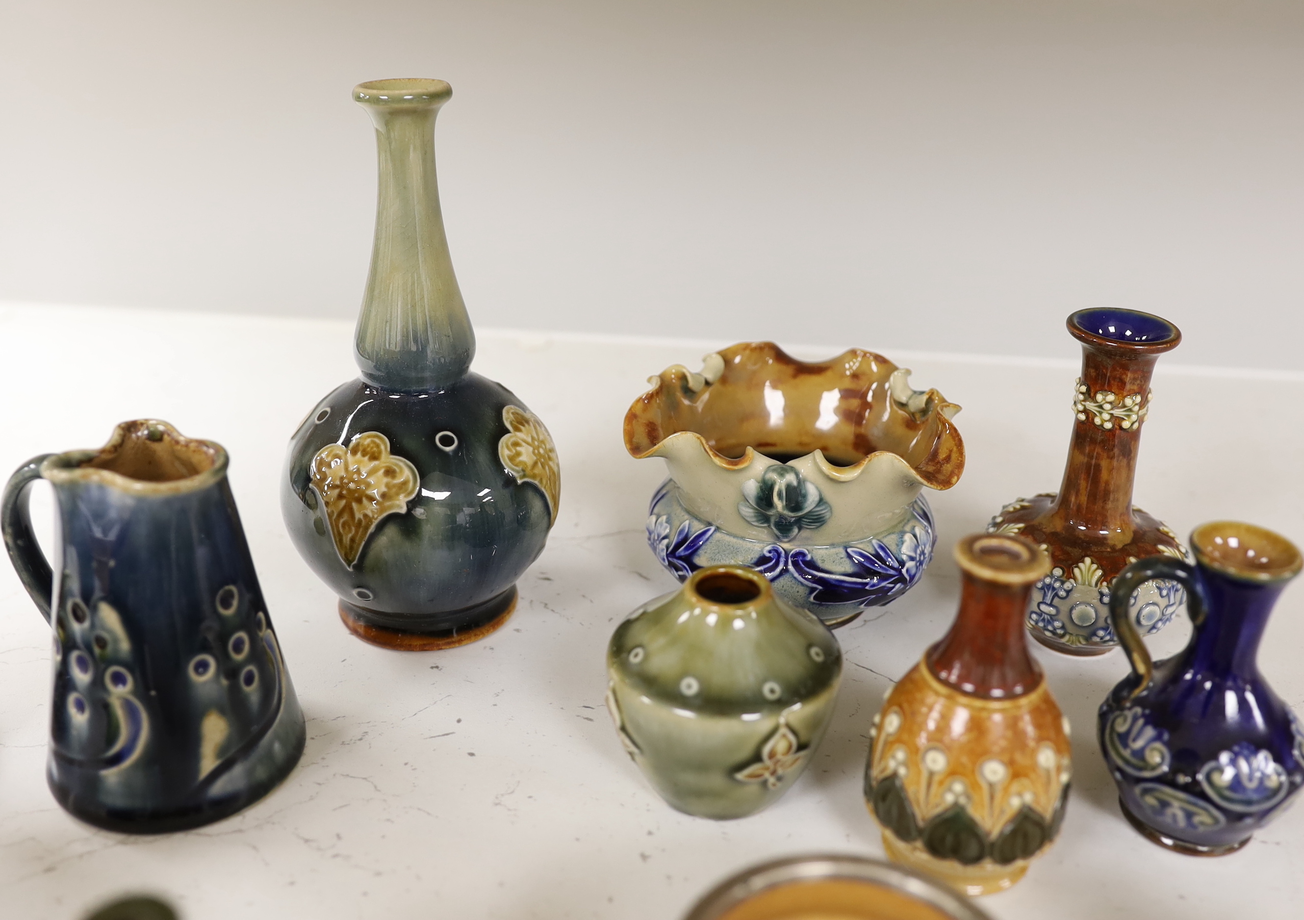 Sixteen miniature Doulton Stoneware items including bowls, vases, jugs, etc., tallest, 14.5cm